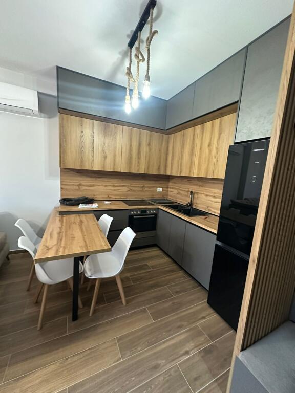 1+1,luxury furnished,near the red school.price 650 thousand lek