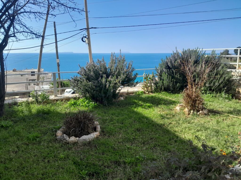 Three-story building for sale very close to the sea