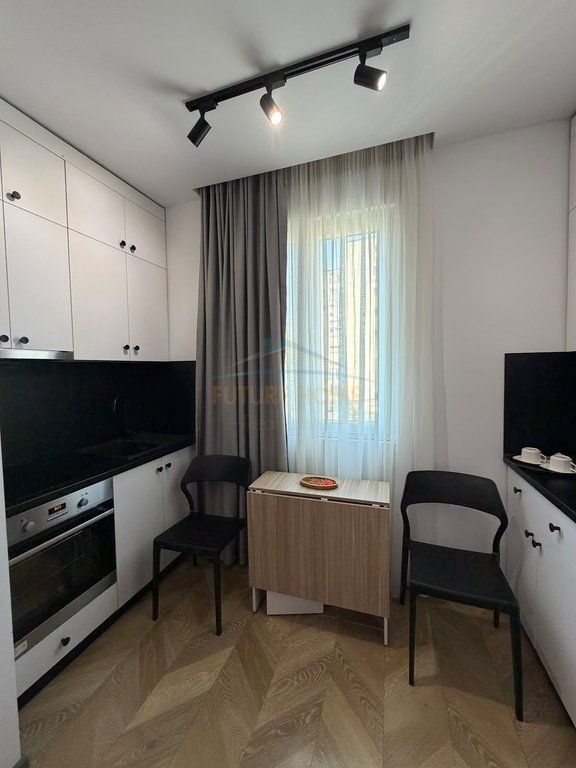 Qera, Garsoniere, Mozaiku i Tiranes, Tiranë